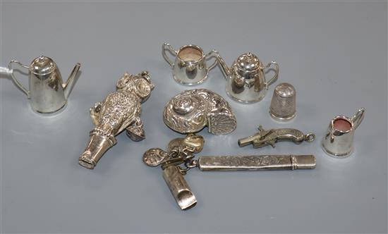 A modern miniature silver four piece tea set, a silver owl teether(a.f.) and other items.